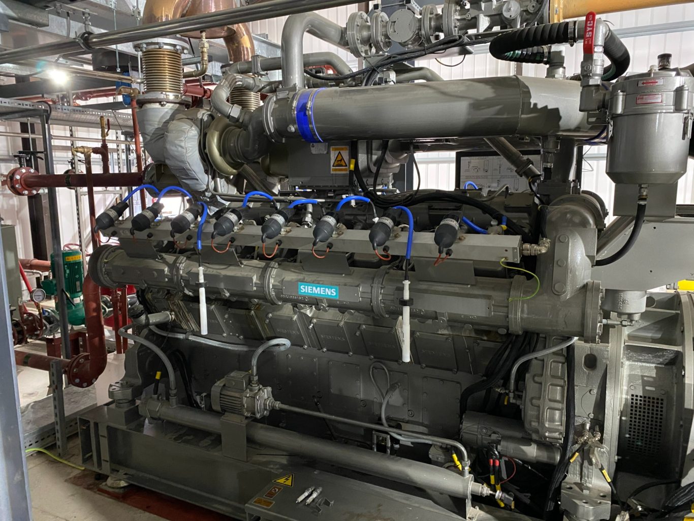 A V16 high speed gas engine in a power response application